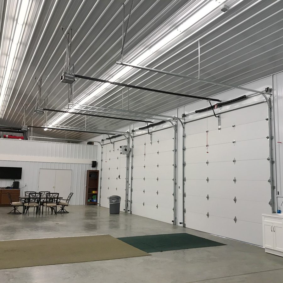 three white overhead doors