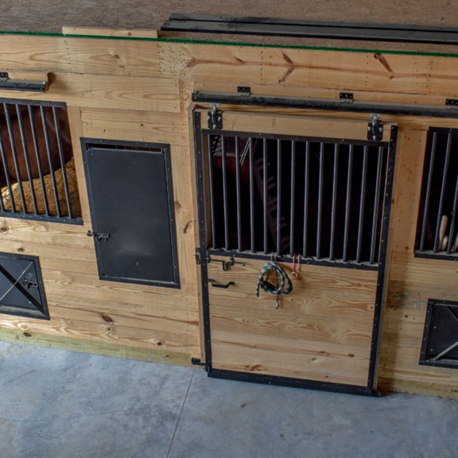 wooden and metal horse stall
