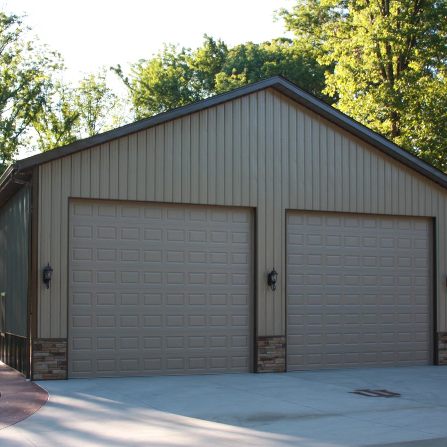 tan metal and affinity stone sided pole garage