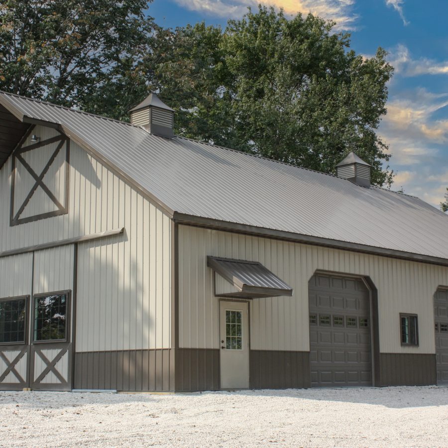 large brown and tan metal post frame building