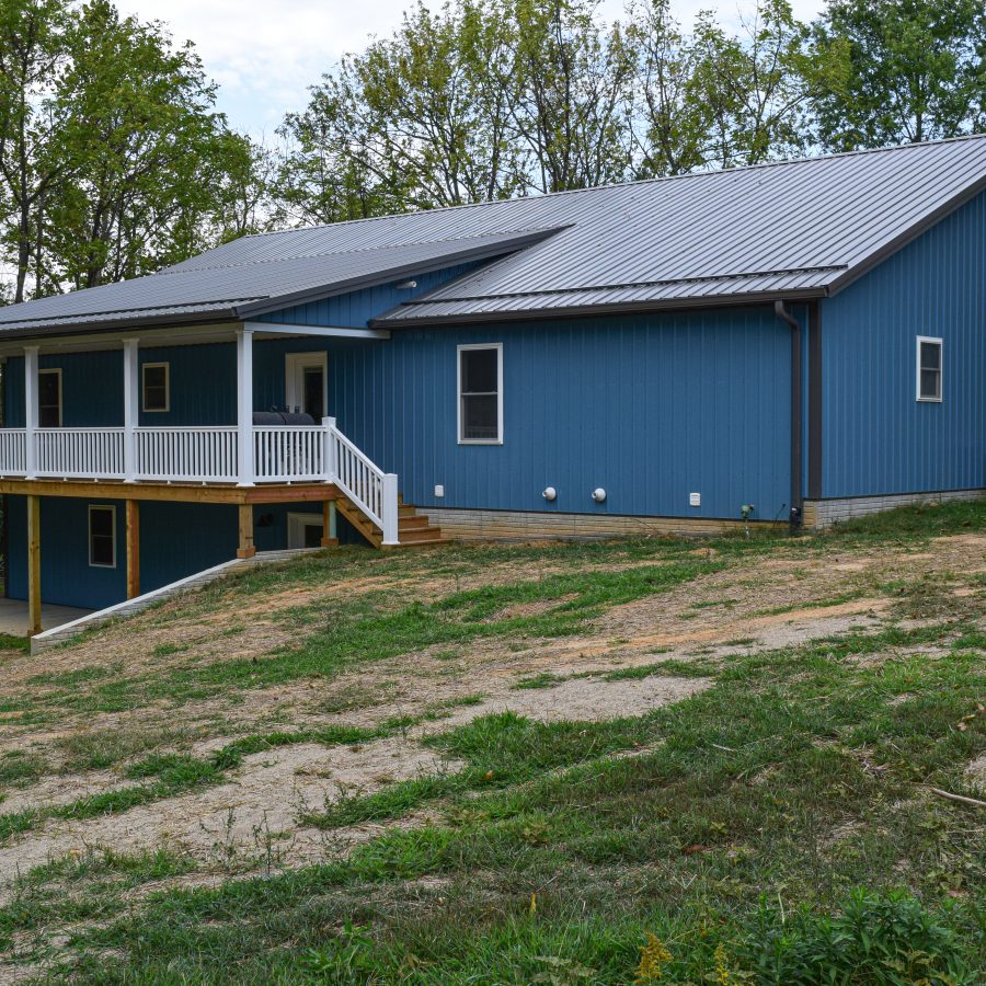 new teal blue two story post frame building