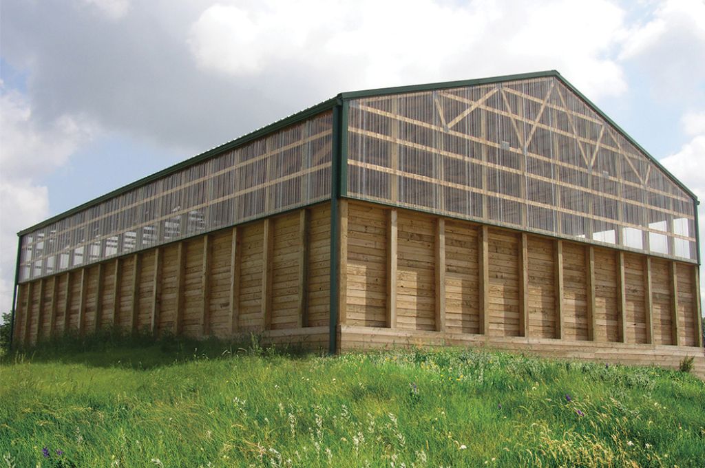 custom pole barn construction showcasing full wood framing 